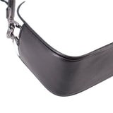 Curved black side of the two-tone camera crossbody bag with chain strap