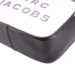 White front corner with black edge seam detail on the two-tone camera bag