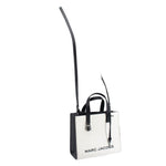 White mini tote with black panels and crossbody strap, brand text on front