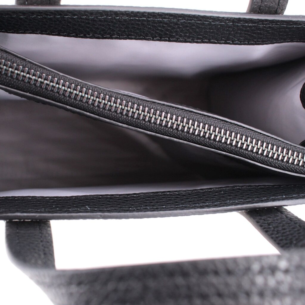 Interior view of mini tote with black zipper and dark lining