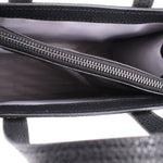 Interior view of mini tote with black zipper and dark lining