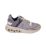 Gray running sneakers with white laces, cream heel panel, lime detailing on outsole