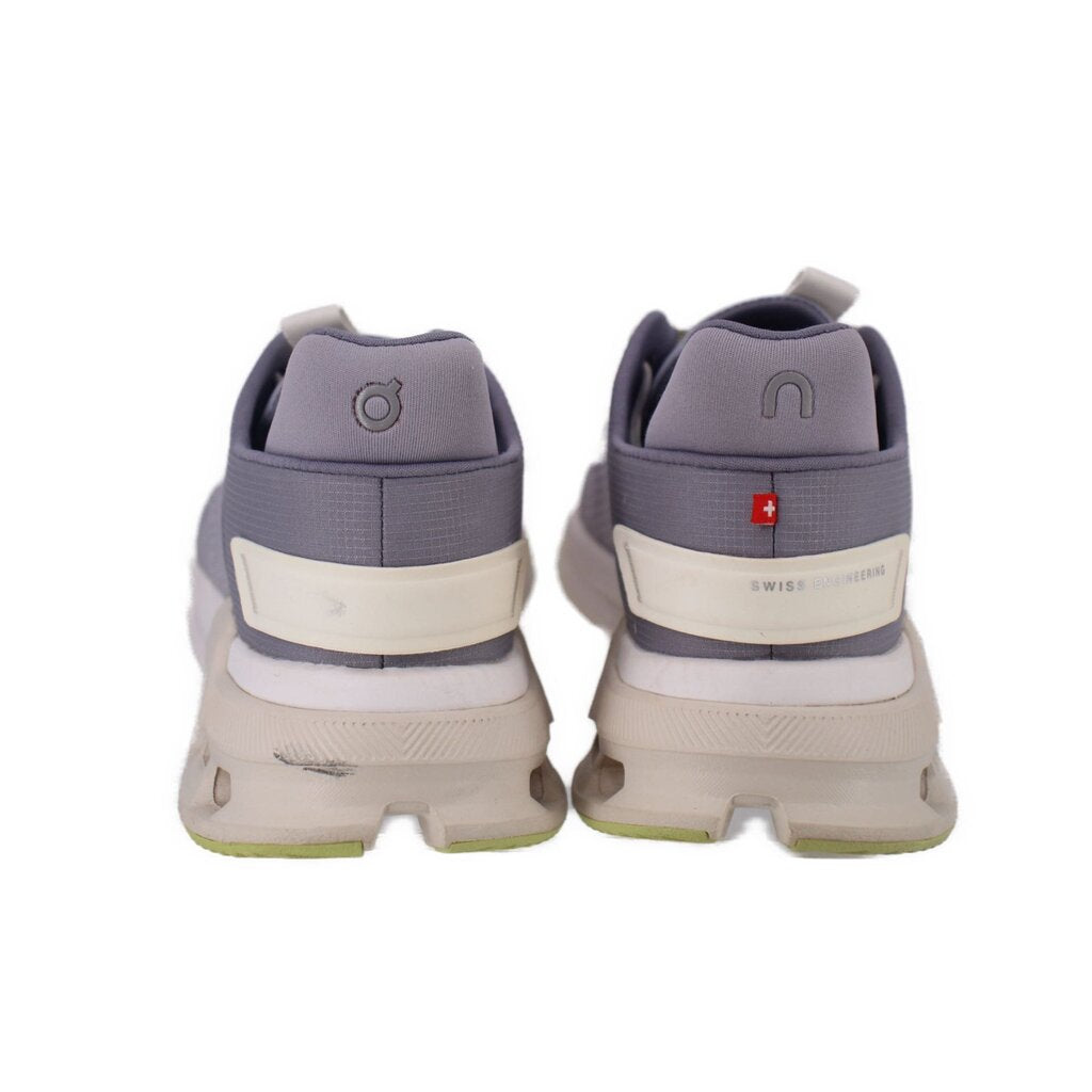 Gray sneakers with cream heel strip, padded ankle collar, small red logo patch