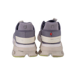Gray sneakers with cream heel strip, padded ankle collar, small red logo patch
