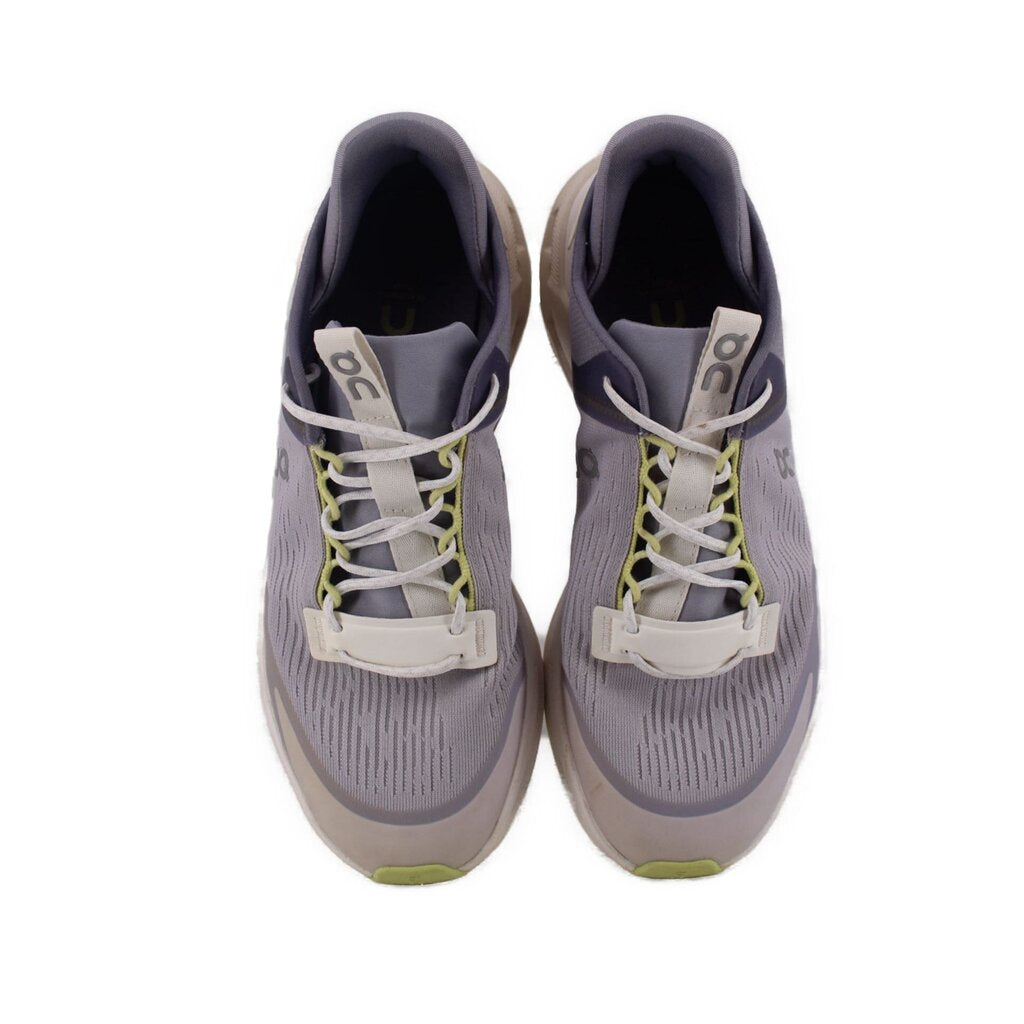 Gray lace-up sneakers with lime accent laces and padded tongue, both shoes shown