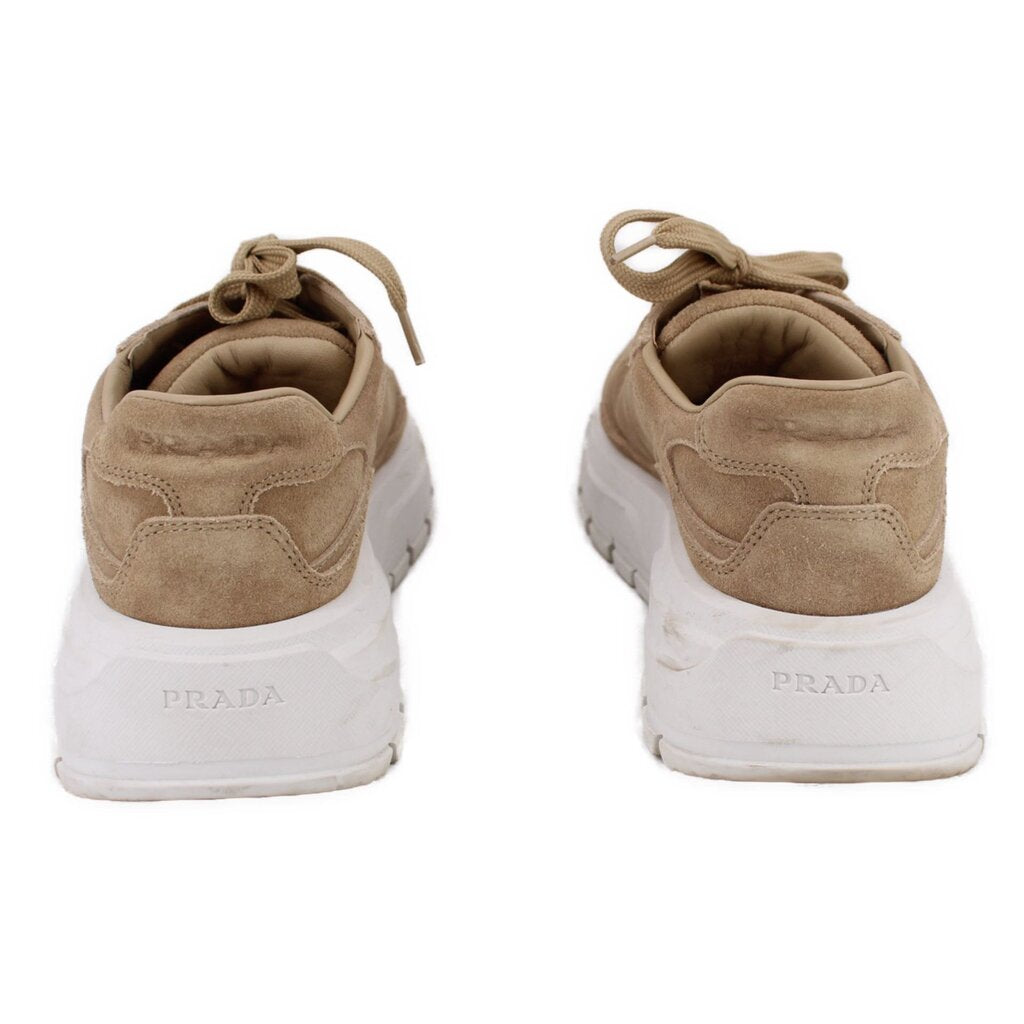 PRADA tan suede sneakers, back view with PRADA logo on white heel sole