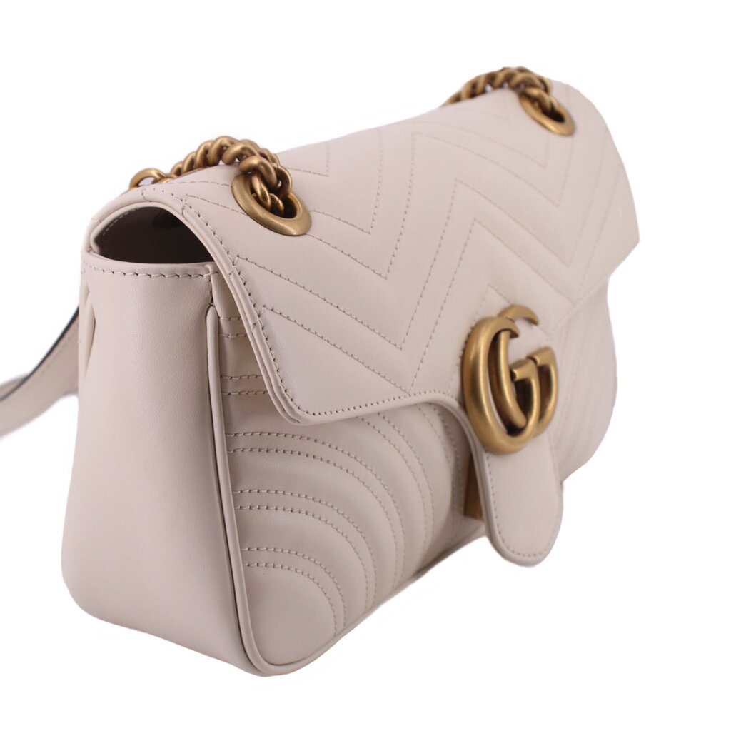 Cream medium shoulder bag side view with chain strap and gold-tone GG clasp