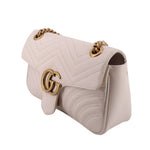 Cream medium shoulder bag flap with gold-tone GG logo and chain strap