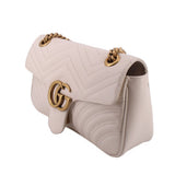 Cream medium shoulder bag flap with gold-tone GG logo and chain strap