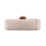 Cream medium shoulder bag bottom view with reinforced base stitching and top hardware