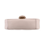 Cream medium shoulder bag bottom view with reinforced base stitching and top hardware
