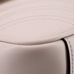 Cream leather trim close-up with edge stitching and smooth panel