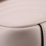 Cream leather trim close-up with edge stitching and smooth panel