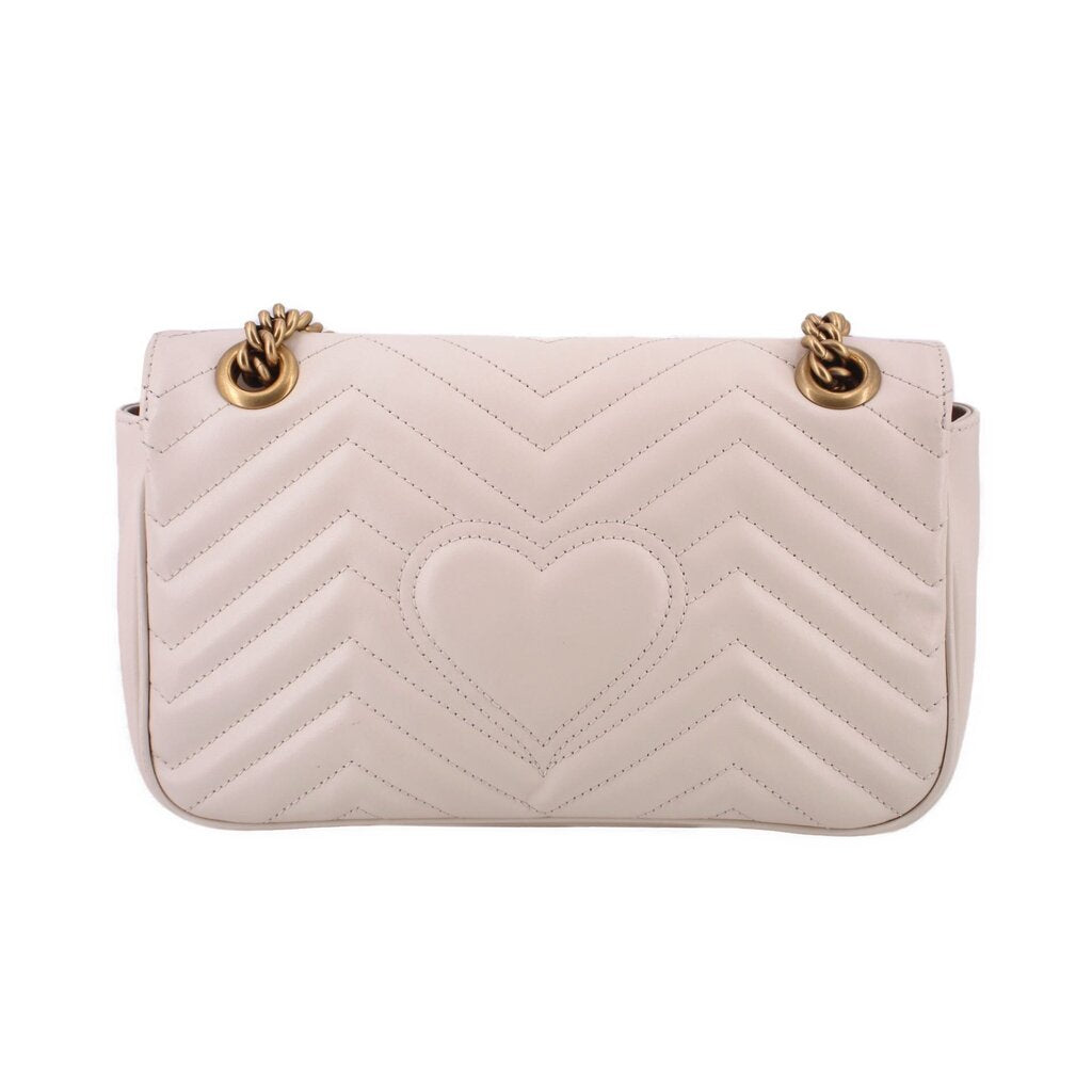 Cream chevron quilted medium shoulder bag with two top ring details