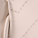 Cream quilted leather panel with stitched edge detail
