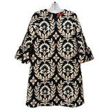 Black printed V-neck dress with short sleeves and ornate floral damask pattern.