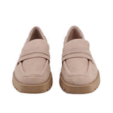 Pair of tan suede loafers, penny-style strap across the vamp, chunky sole
