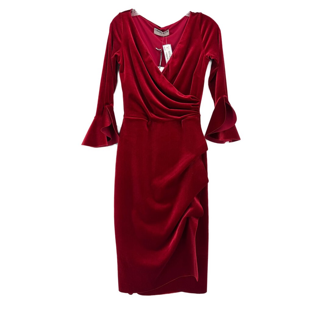 Red velvet dress with draped V-neck, long bell sleeves, and side slit