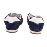 Back view of blue suede sneaker with white collar trim and gum sole