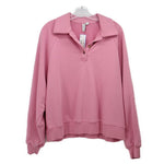 Pink long sleeve top with collared quarter-zip and ribbed cuffs