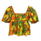 Orange printed peasant top with square neckline and puff sleeves, tropical leaf pattern