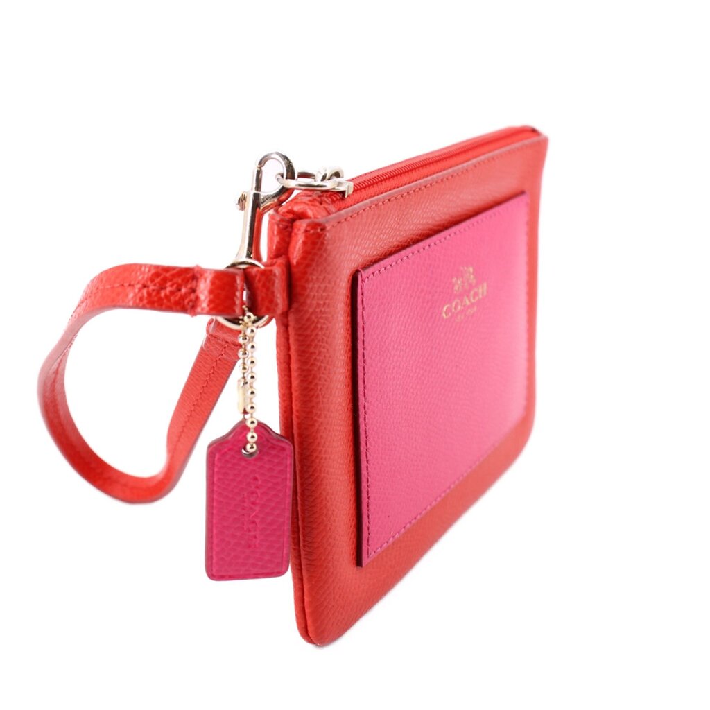 Red/pink wristlet pouch with zipper top and attached pink keychain tag
