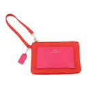 COACH wristlet pouch in red/pink with wrist strap and pink front logo pocket