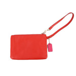 Red wristlet pouch with adjustable wrist strap and pink hanging charm tag
