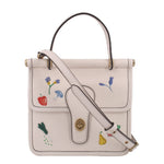 Cream top-handle crossbody with garden floral embroidery and gold-tone clasp