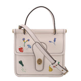 Cream top-handle crossbody with garden floral embroidery and gold-tone clasp