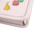Close-up of cream bag corner with floral embroidery and stitched edge