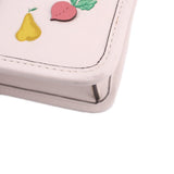 Close-up of cream bag corner with floral embroidery and stitched edge