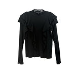 Black long-sleeve top with layered ruffle shoulder detail and crew neckline