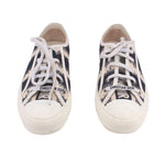 Pair of lace-up low-top sneakers with black-and-white D-Stripe uppers, DIOR patch