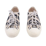 DIOR D-stripe sneakers, black-and-cream canvas with white laces and logo on the tongue