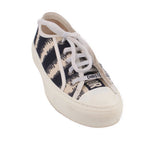 Black and white D-Stripe low-top sneakers with lace-up front and DIOR label