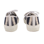 Back view lace-up sneakers with black-and-white stripe heel panel and DIOR branding
