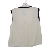 Cream sleeveless top with black collar trim shown from the back