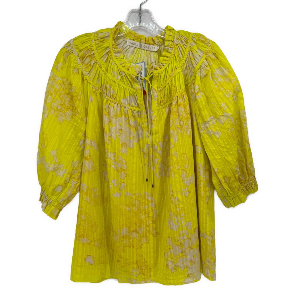 Yellow print blouse with gathered yoke, front button placket, and puff sleeves
