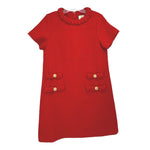 Red tweed dress with scalloped neckline and decorative gold buttons