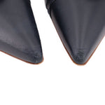 Navy leather pointed-toe heel close-up of smooth upper and seam