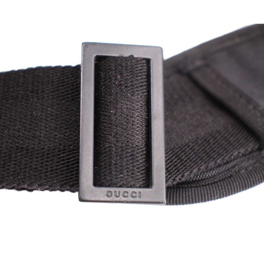 GUCCI crossbody strap adjustment slide with GUCCI branding