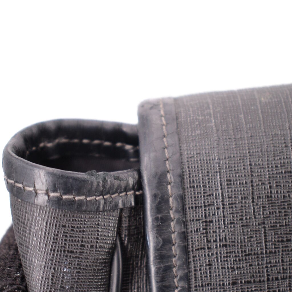 GUCCI messenger crossbody bag close-up of fabric strap attachment and stitching