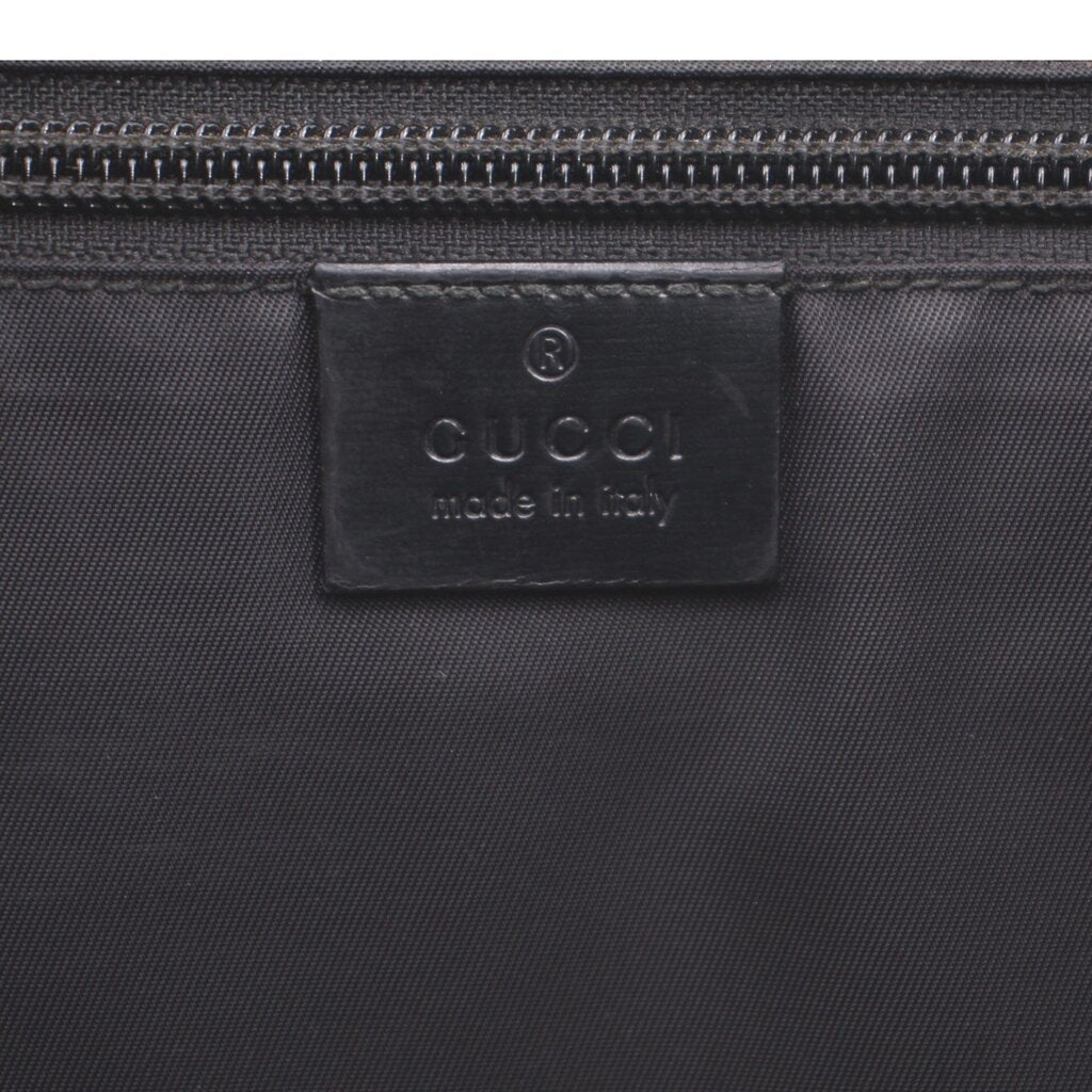 GUCCI messenger crossbody bag interior label near zipper closure