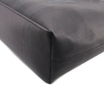 Black tote crossbody bag corner seam detail with curved edge and stitching