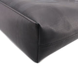 Black tote crossbody bag corner seam detail with curved edge and stitching