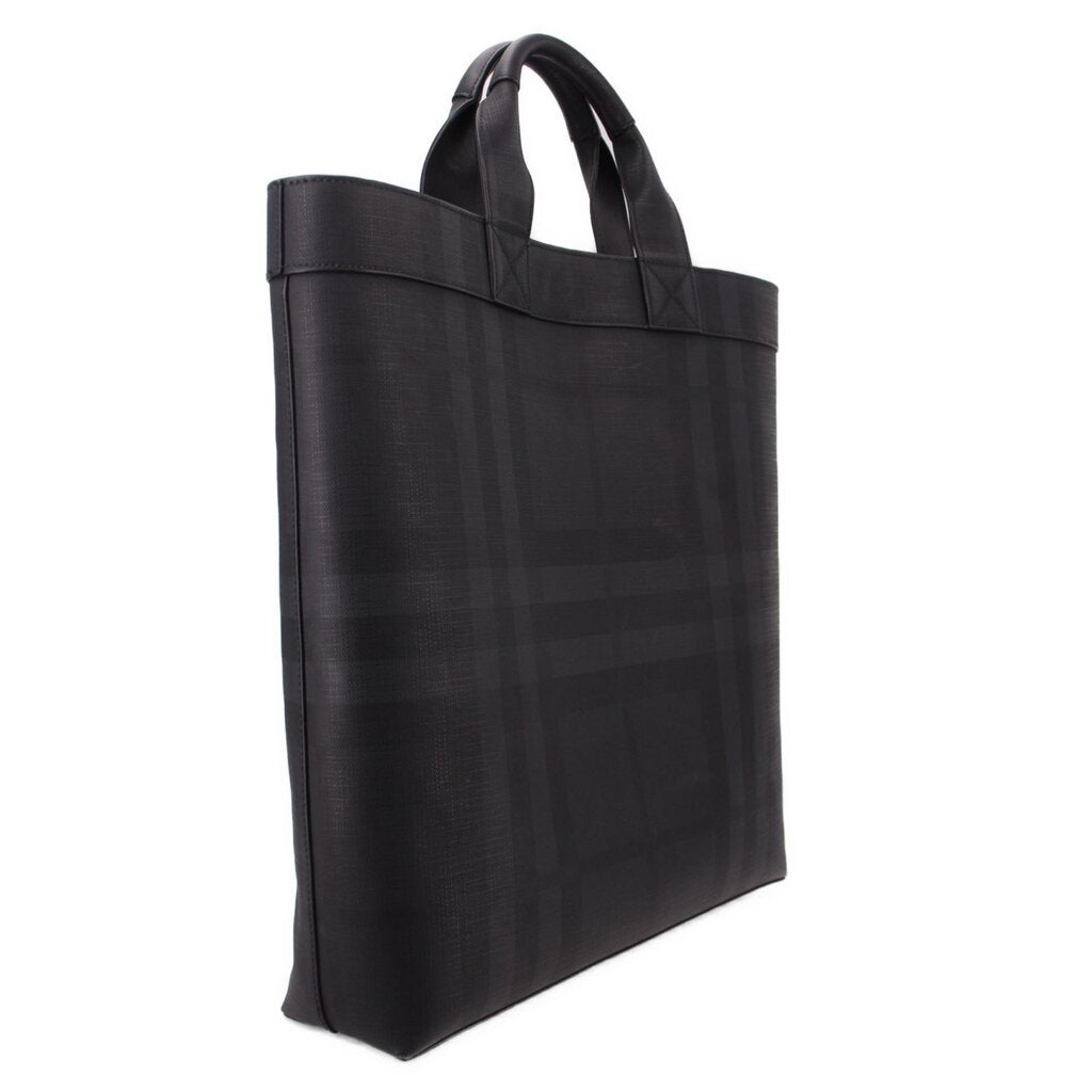 Black tote bag side profile with structured edges and top handle