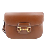 Brown leather shoulder bag with gold Horsebit 1955 clasp.