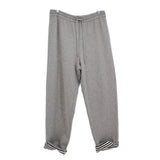 Gray sweatpants with drawstring and striped ribbed ankle cuffs
