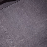 Dark navy quilted leather fabric close-up with fine crosshatch texture